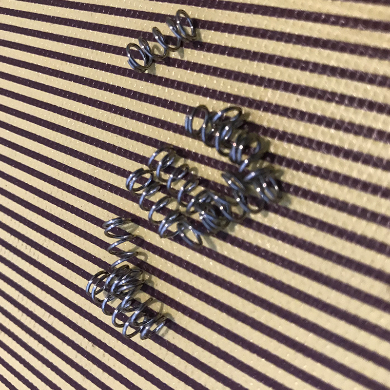 Electric guitar bridge spring
