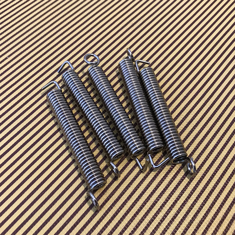 Electric guitar body spring