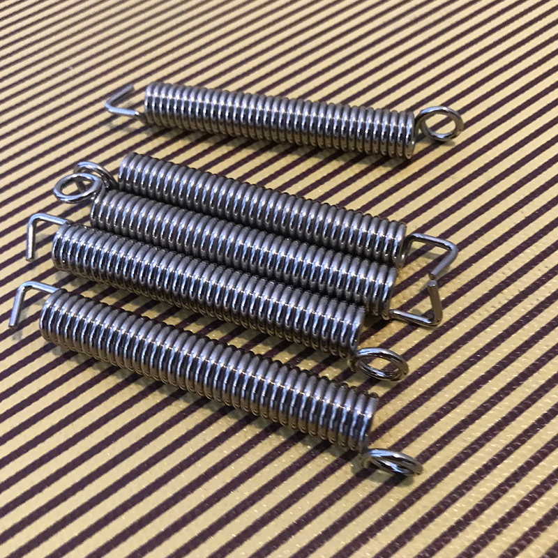 Electric guitar body spring