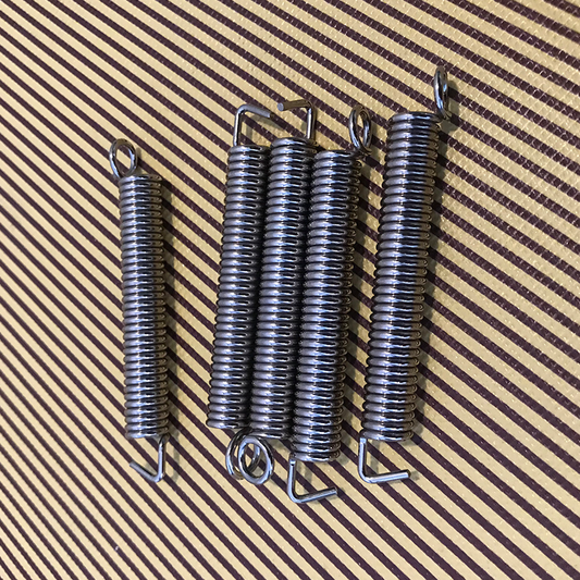 Electric guitar body spring